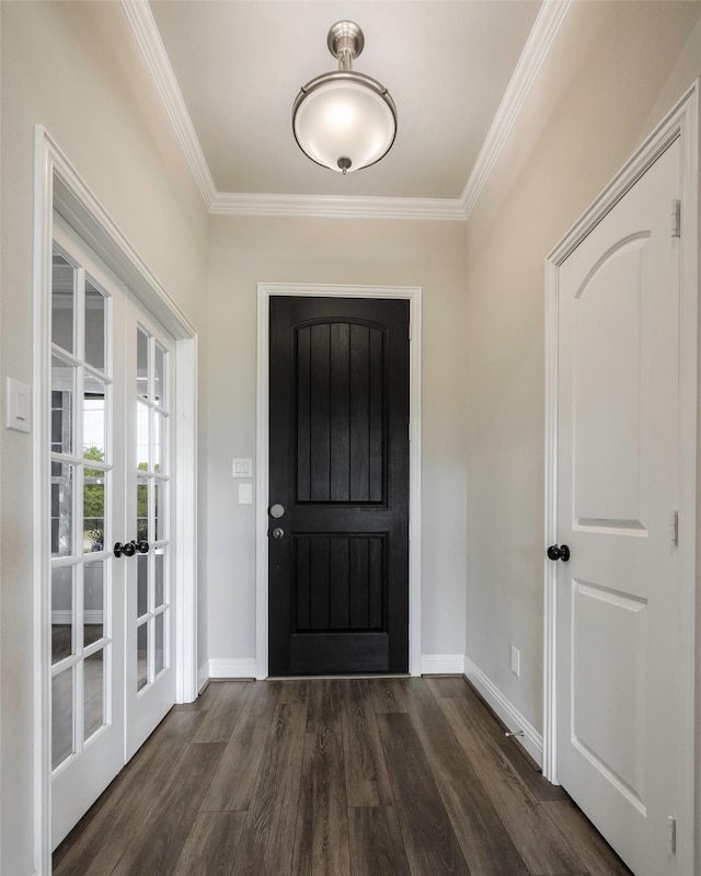 entrance foyer featuring dark wood-type flooring, crown molding, and french doors