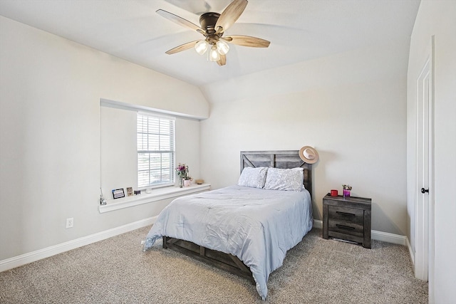 carpeted bedroom featuring ceiling fan and vaulted ceiling