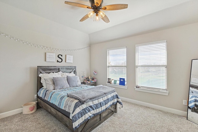 bedroom with ceiling fan, light carpet, and lofted ceiling