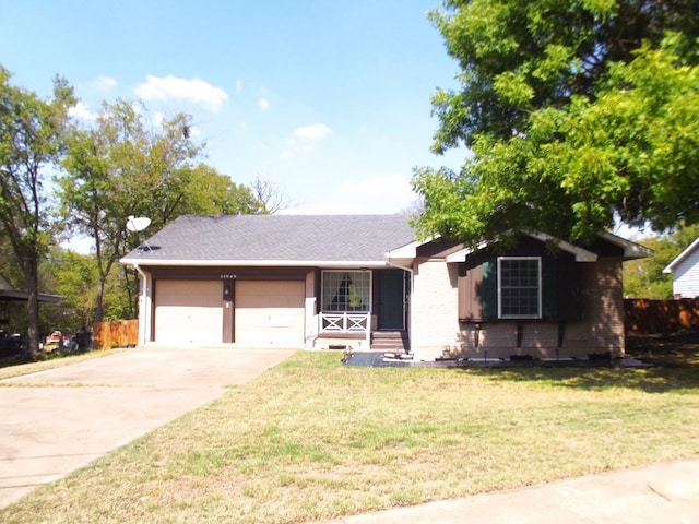 single story home with a front yard and a garage