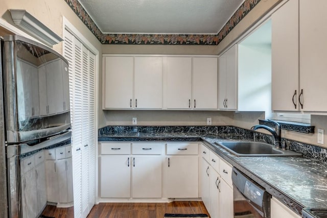 kitchen with dark wood-type flooring, sink, white cabinetry, and dishwasher