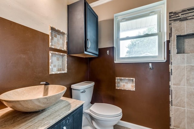 bathroom featuring toilet and vanity