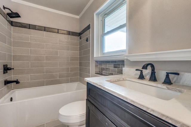 full bathroom featuring toilet, tiled shower / bath, tile patterned flooring, ornamental molding, and vanity