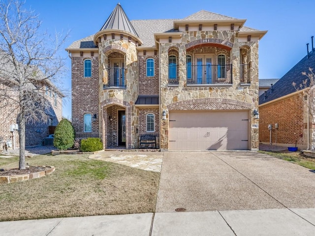 view of front of home with a balcony and a garage