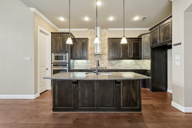 1776 Halifax St, Roanoke, TX 76262 - kitchen featuring stainless steel appliances, dark brown cabinets, wall chimney exhaust hood, baseboards, and dark stone countertops