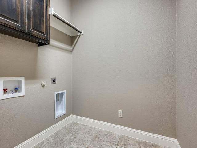 laundry area with cabinets, hookup for an electric dryer, hookup for a washing machine, and hookup for a gas dryer