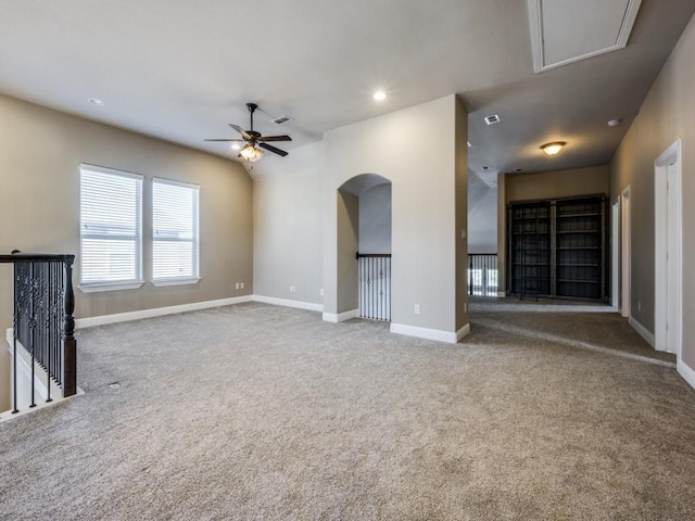 unfurnished living room featuring ceiling fan and carpet floors