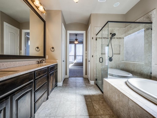 bathroom with ceiling fan, vanity, and plus walk in shower