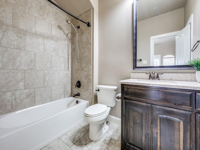 full bathroom featuring toilet, tiled shower / bath combo, and vanity