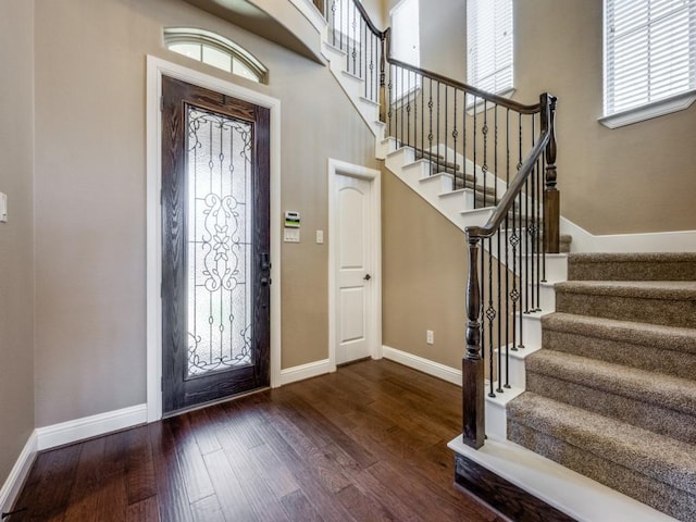 entryway with dark hardwood / wood-style floors