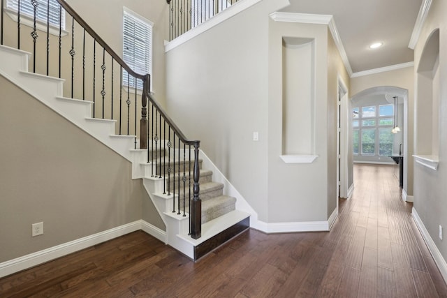 1776 Halifax St, Roanoke, TX 76262 - stairs with ornamental molding, arched walkways, wood finished floors, baseboards, and recessed lighting