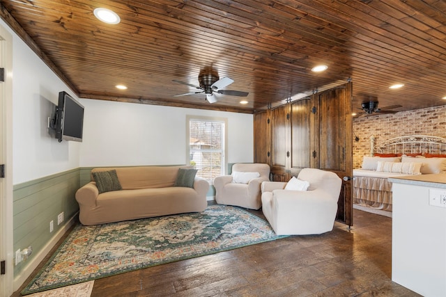 living room featuring ceiling fan, wooden ceiling, brick wall, and dark hardwood / wood-style flooring