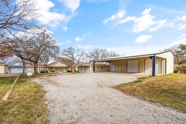 ranch-style home with a detached garage