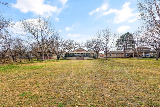 view of yard featuring a sunroom