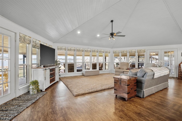 living room featuring ceiling fan, hardwood / wood-style floors, lofted ceiling, and french doors