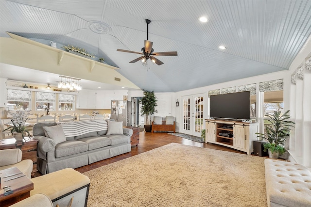 living room with ceiling fan, dark hardwood / wood-style floors, and high vaulted ceiling