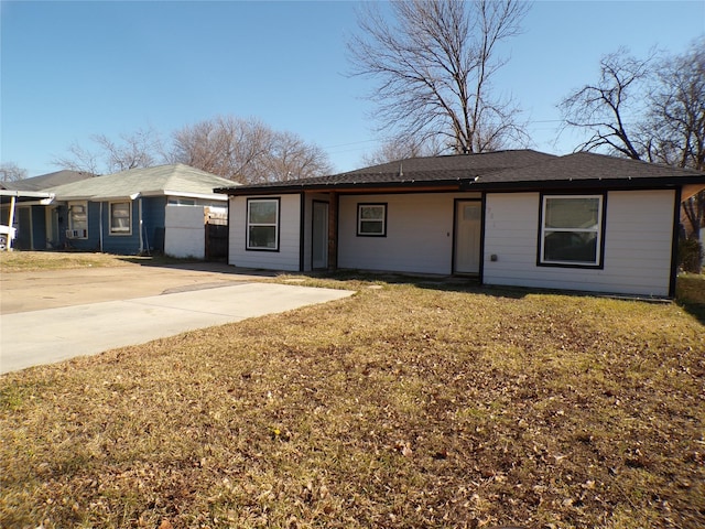 ranch-style home featuring a front yard