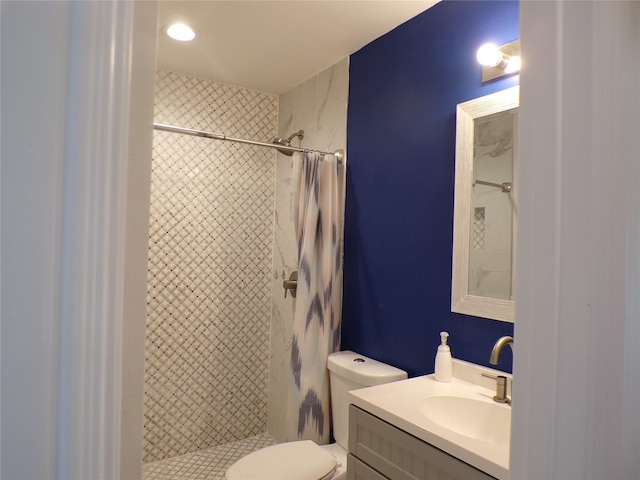 bathroom featuring toilet, a shower with curtain, and vanity