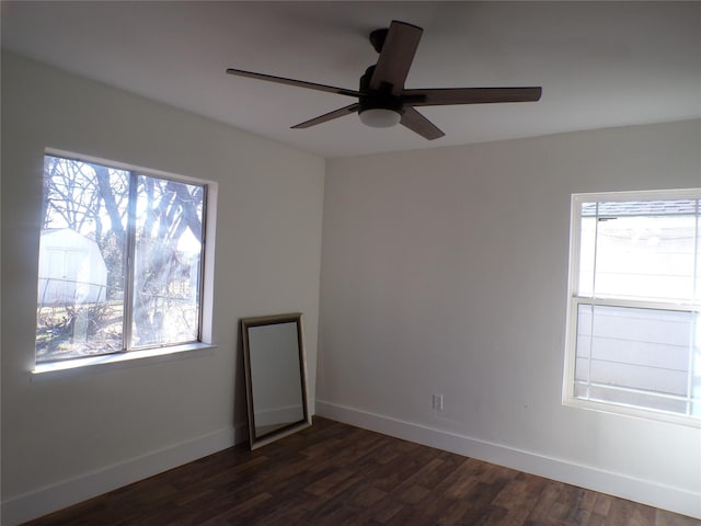 spare room with ceiling fan and dark wood-type flooring