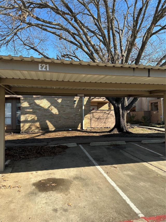 view of vehicle parking featuring a carport