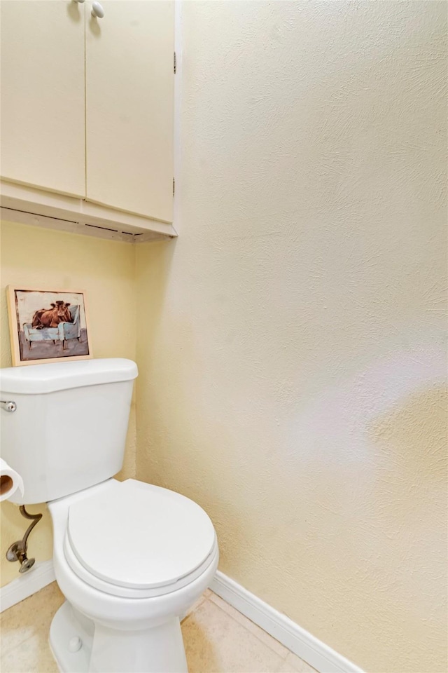 bathroom with tile patterned floors and toilet