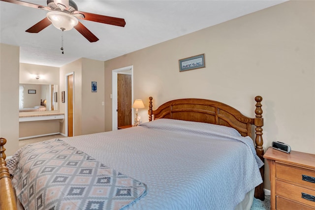 bedroom featuring ceiling fan, light carpet, and connected bathroom