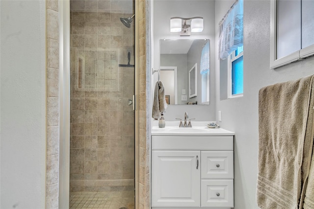 bathroom with vanity and an enclosed shower