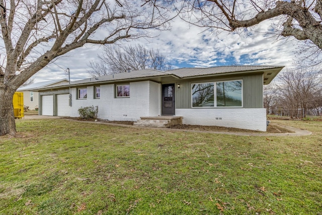 single story home with a front lawn and a garage