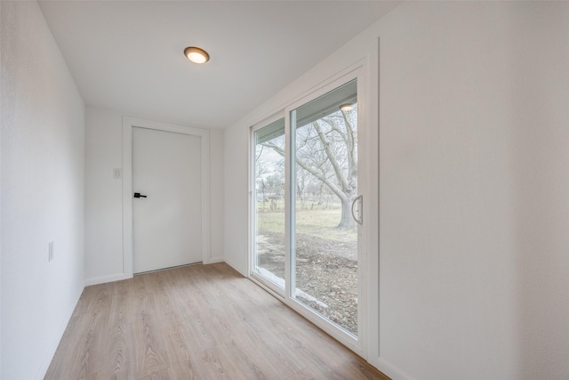 spare room featuring light wood-type flooring