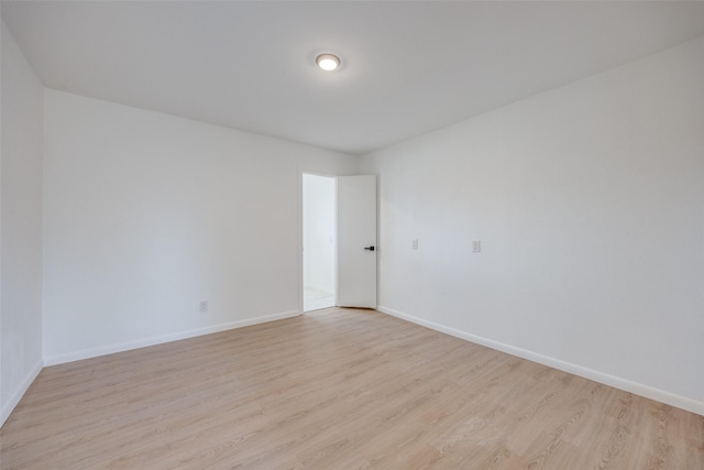 unfurnished room with light hardwood / wood-style floors