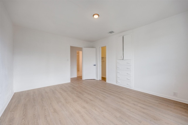 unfurnished room with light hardwood / wood-style flooring