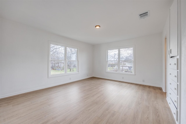 unfurnished room featuring light hardwood / wood-style floors