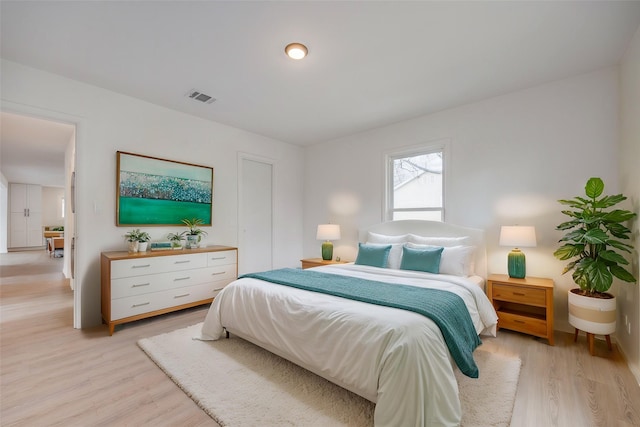 bedroom with light hardwood / wood-style floors