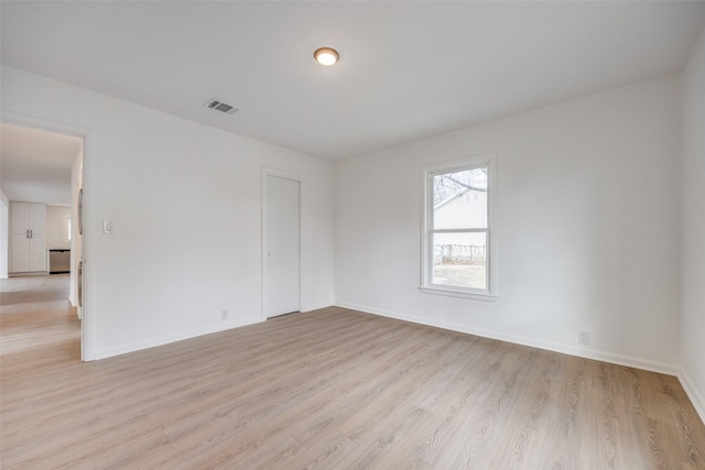 unfurnished room featuring light hardwood / wood-style floors