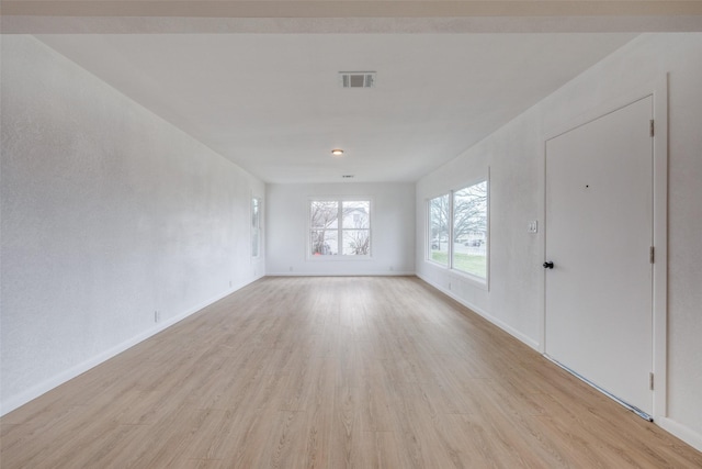 spare room with light hardwood / wood-style flooring