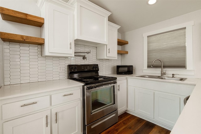 kitchen featuring white cabinetry, stainless steel electric stove, backsplash, and sink