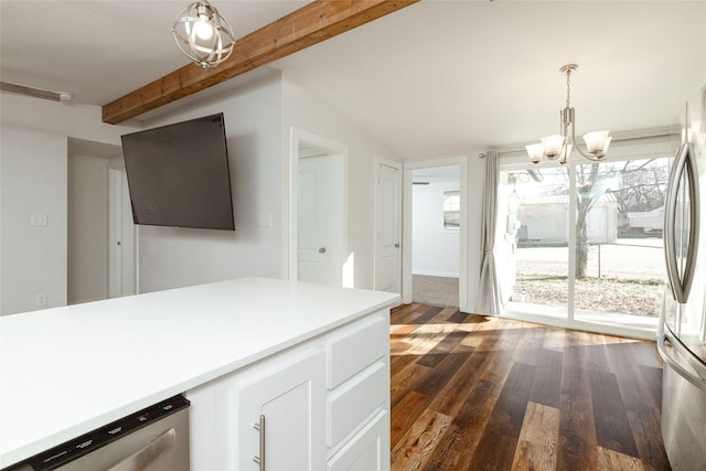 kitchen featuring appliances with stainless steel finishes, vaulted ceiling with beams, an inviting chandelier, hanging light fixtures, and dark hardwood / wood-style floors