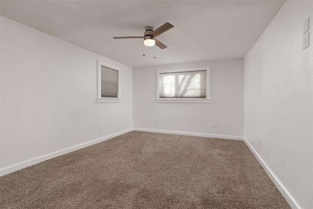 empty room with ceiling fan and carpet