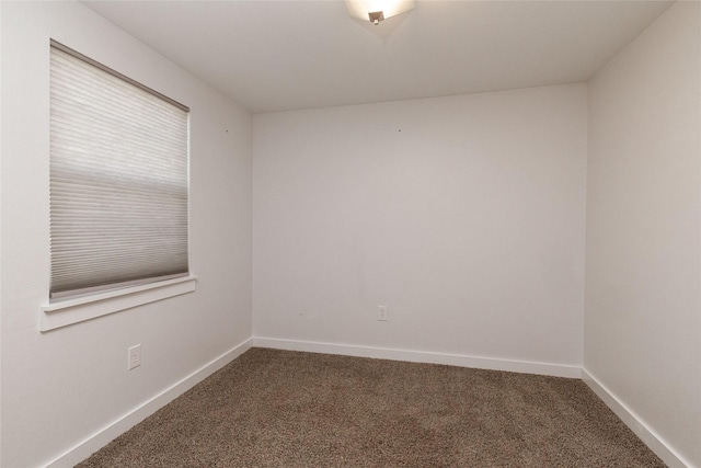 unfurnished room featuring carpet flooring