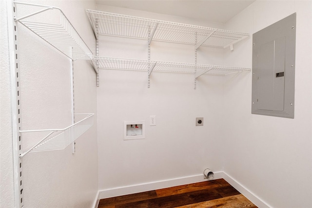 clothes washing area with hardwood / wood-style flooring, electric panel, electric dryer hookup, and hookup for a washing machine