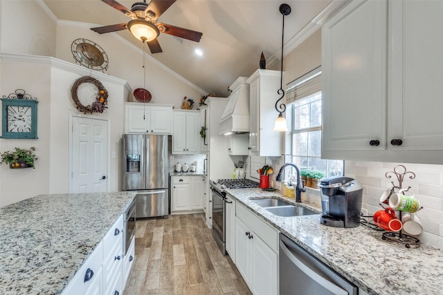 kitchen with white cabinetry, sink, and stainless steel appliances