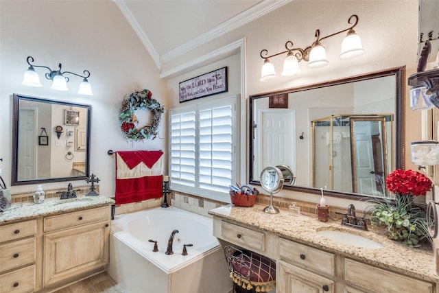 bathroom with ornamental molding, vanity, separate shower and tub, and vaulted ceiling