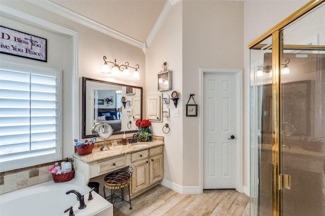 bathroom featuring crown molding, vanity, independent shower and bath, and hardwood / wood-style floors