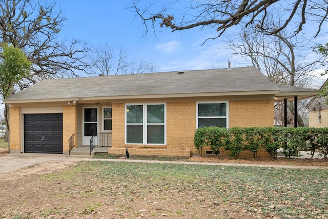 ranch-style home with a garage, driveway, and brick siding