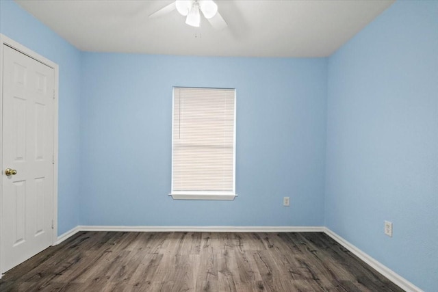 unfurnished room featuring ceiling fan and dark hardwood / wood-style floors