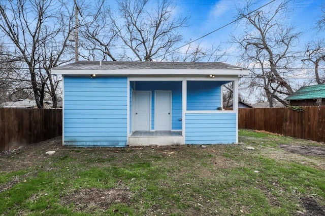 view of outdoor structure with a lawn