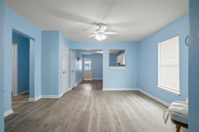 spare room featuring ceiling fan and wood-type flooring