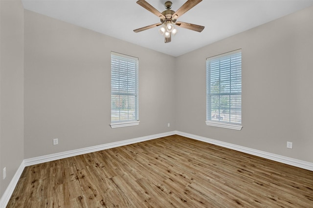 spare room featuring ceiling fan and wood-type flooring