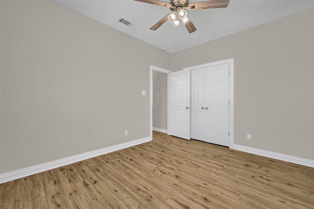 unfurnished bedroom featuring ceiling fan and light hardwood / wood-style flooring