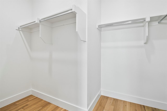 spacious closet featuring hardwood / wood-style flooring